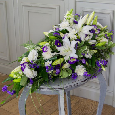 White Lily with Blue and Lime Single Ended Spray to Gerald Burden Funeral Directors